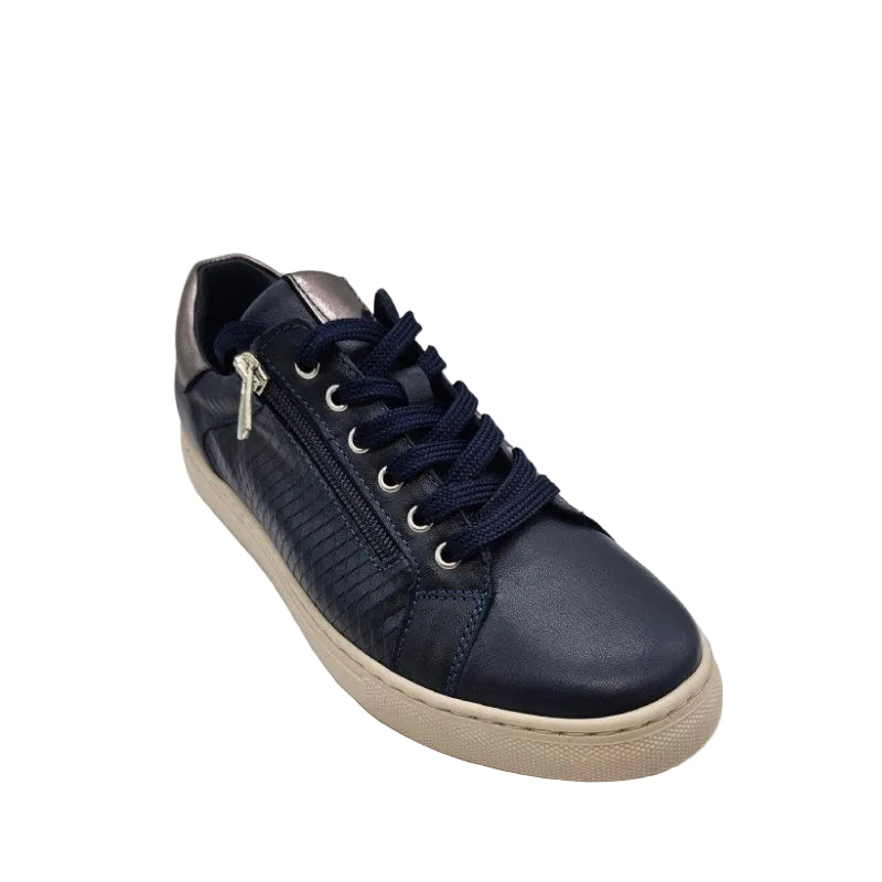 Navy blue sneaker with a beige sole on a light gray background